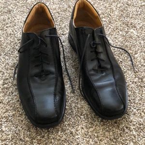 Coach men’s 10 1/2 size black genuine leather dress shoes.